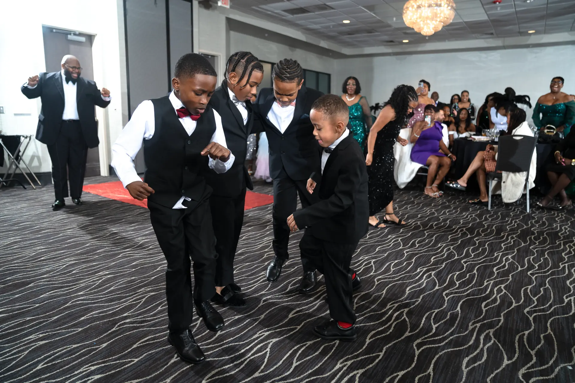 Men in tuxedos posing together at a gala