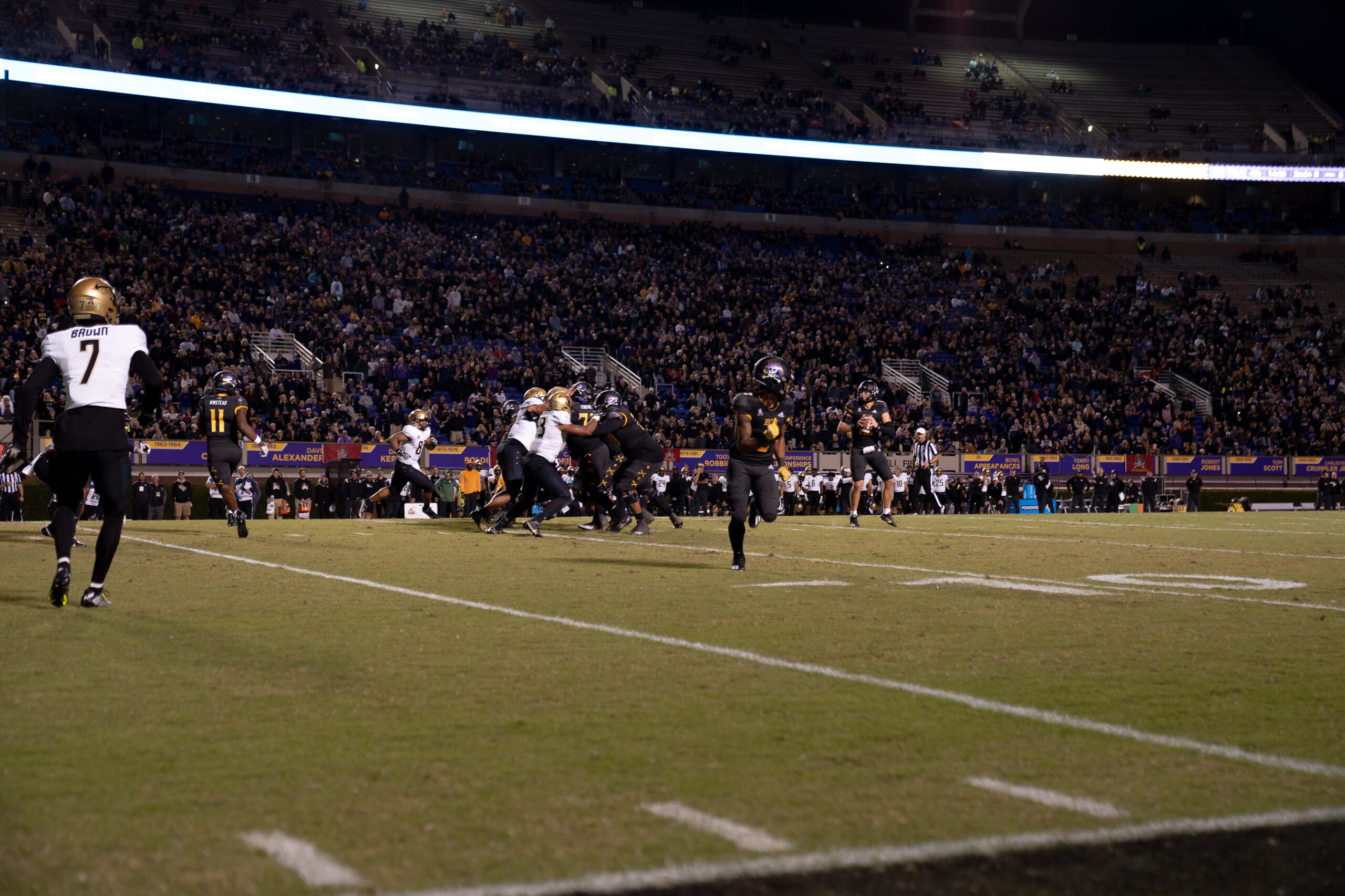 My First ECU College Football Photography Assignment 96 Kickoff coverage team racing downfield at night