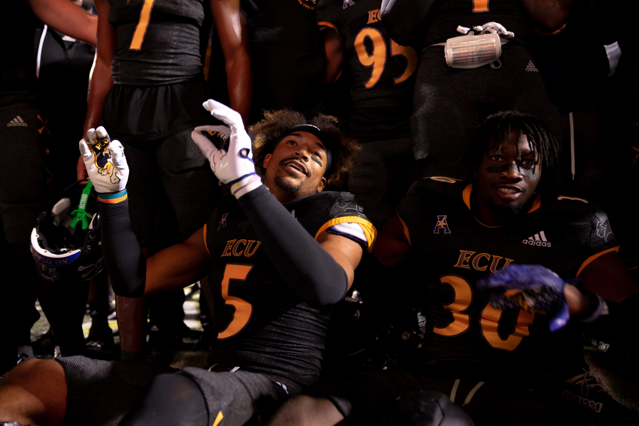 My First ECU College Football Photography Assignment 150 ECU players celebrating together on the sideline at night