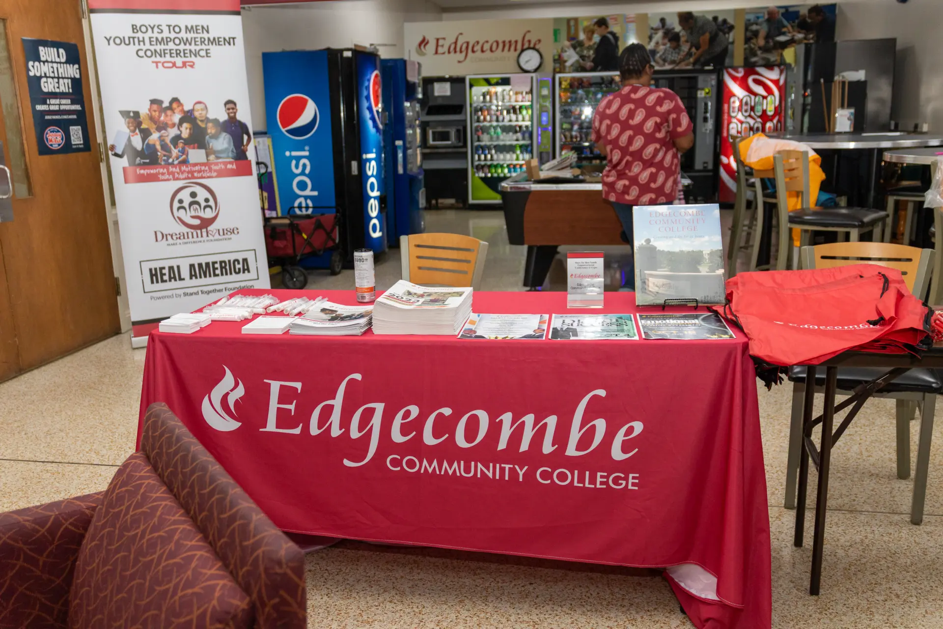 Edgecombe Community College booth with a red table banner