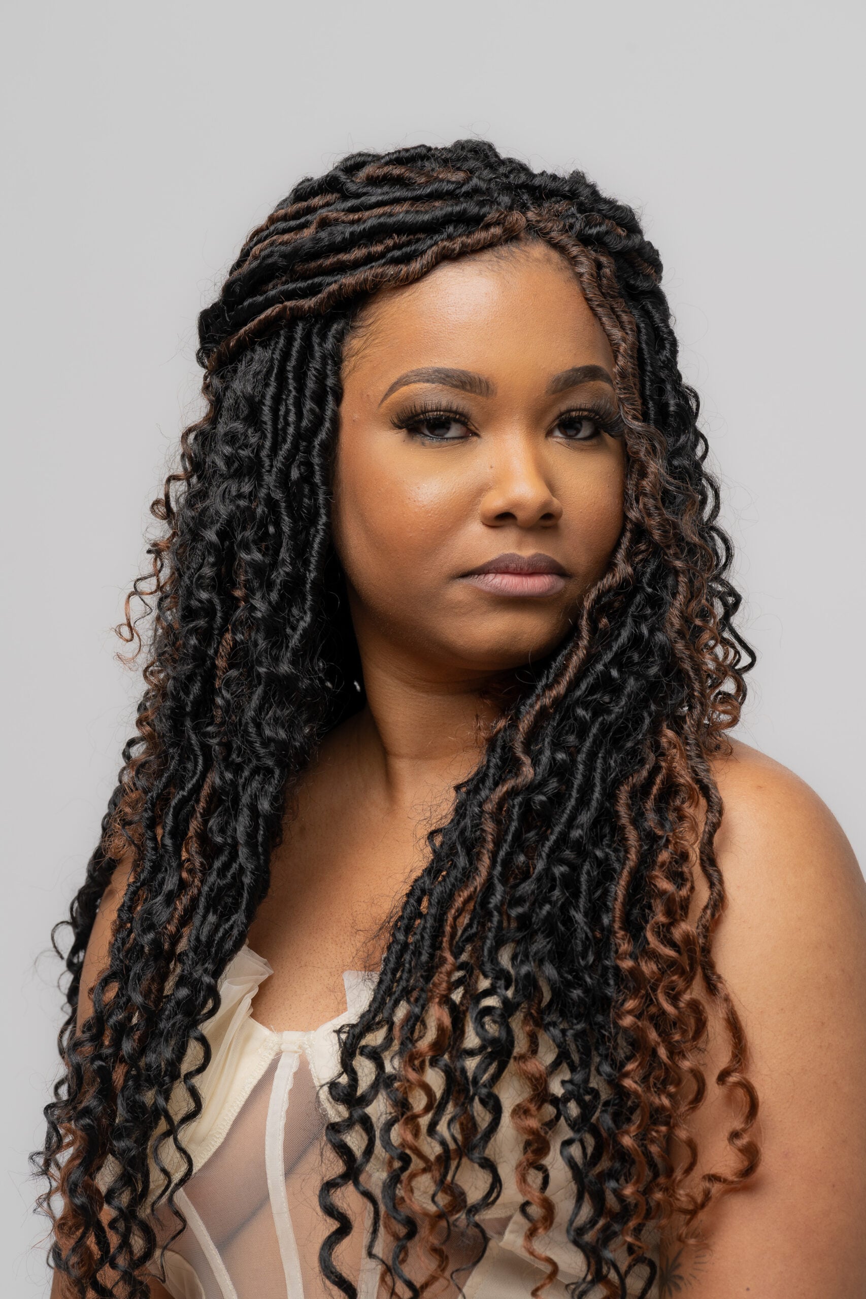 Woman with long braids, warm birthday portrait