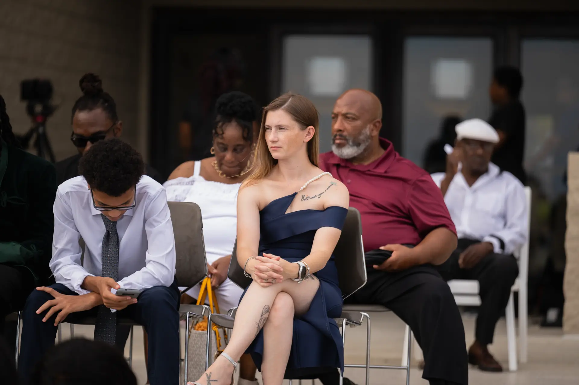 Seated guests watch the ceremony
