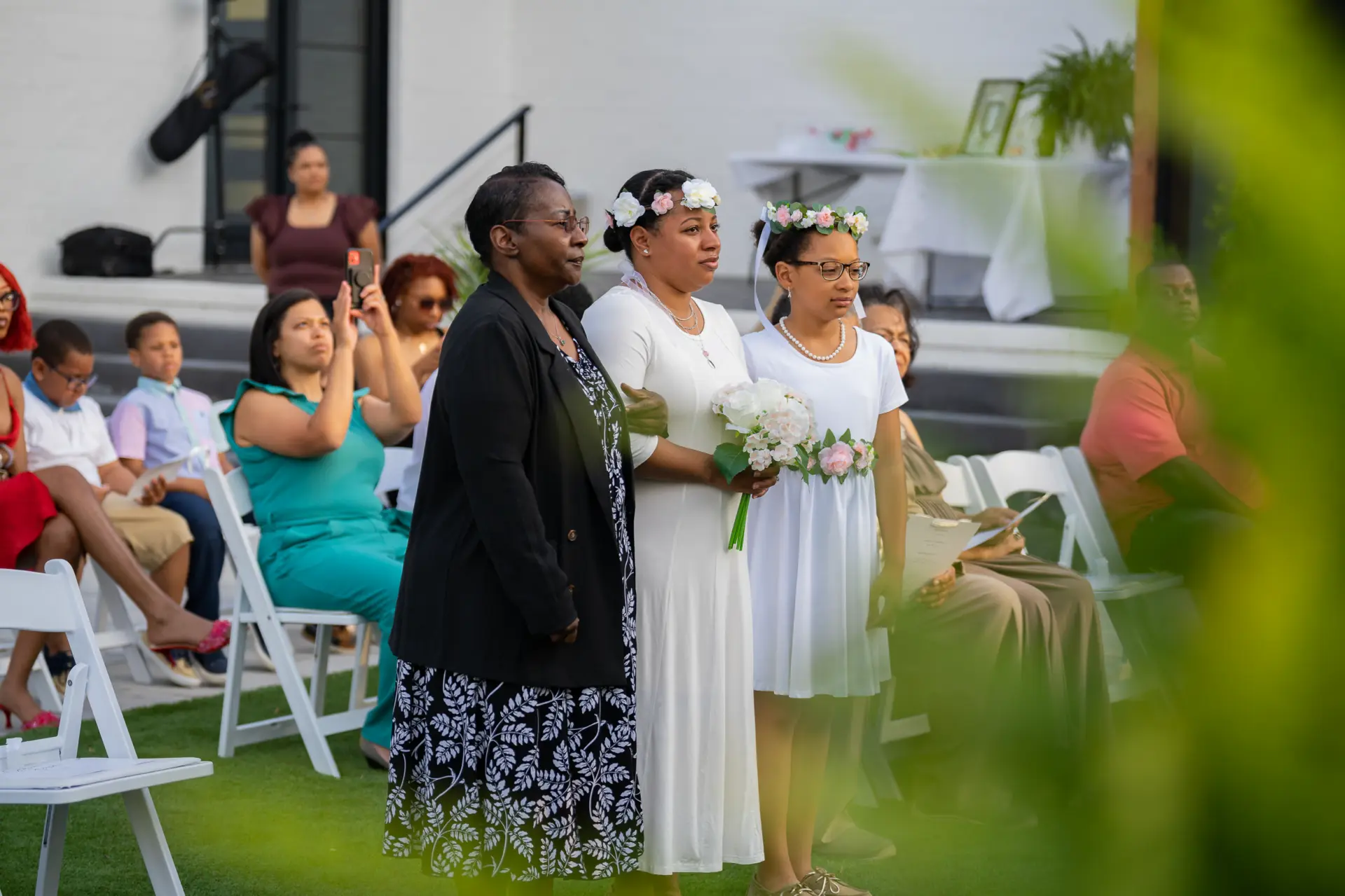 Bride greets guests at a garden ceremony